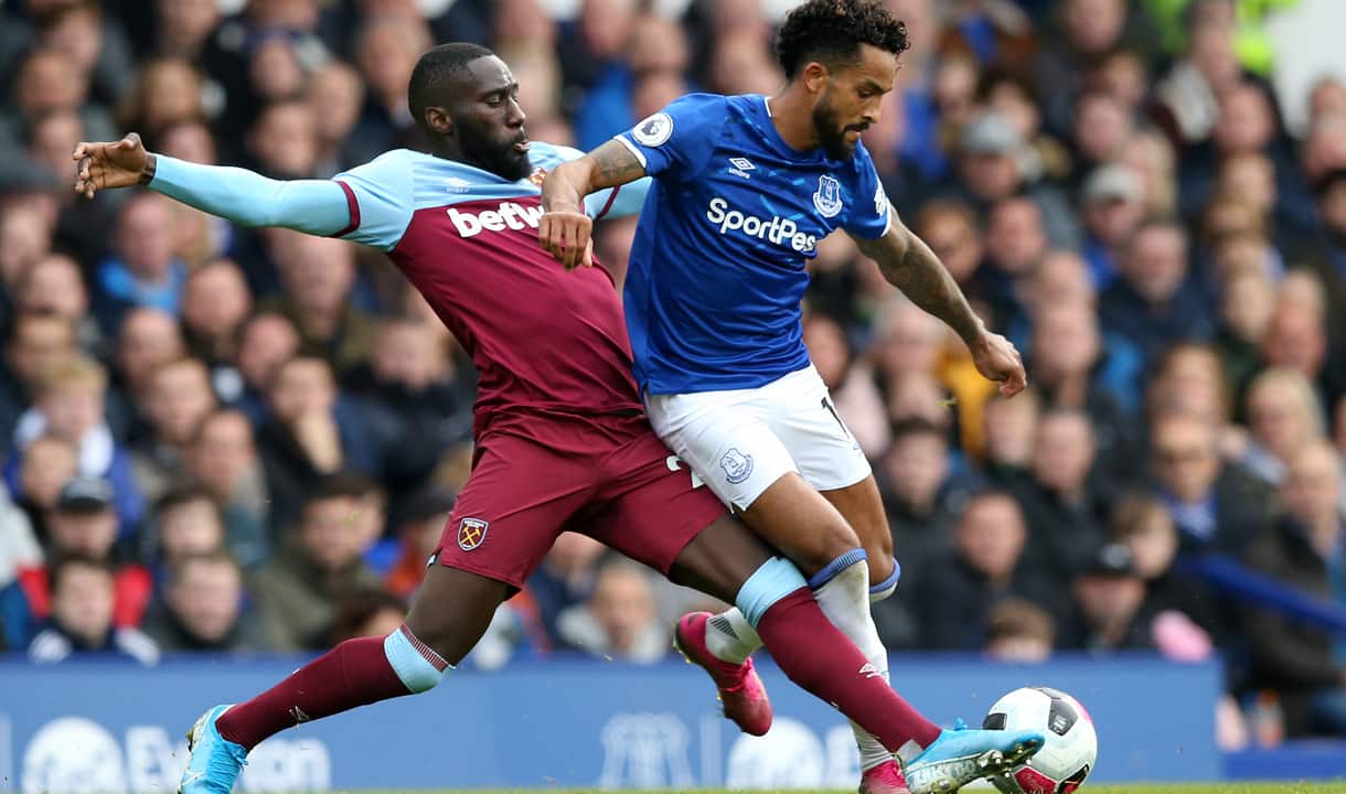 Arthur Masuaku challenges Theo Walcott