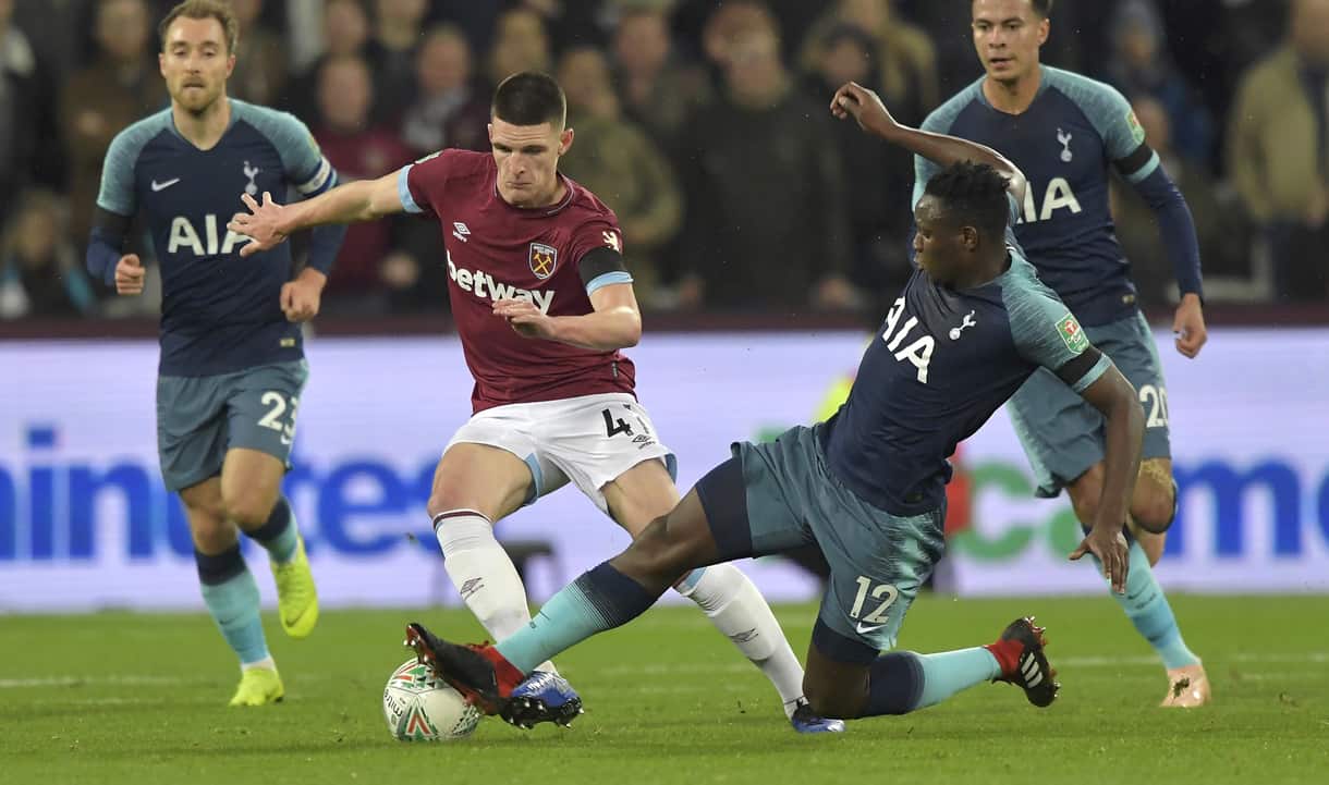Declan Rice is challenged by Victor Wanyama