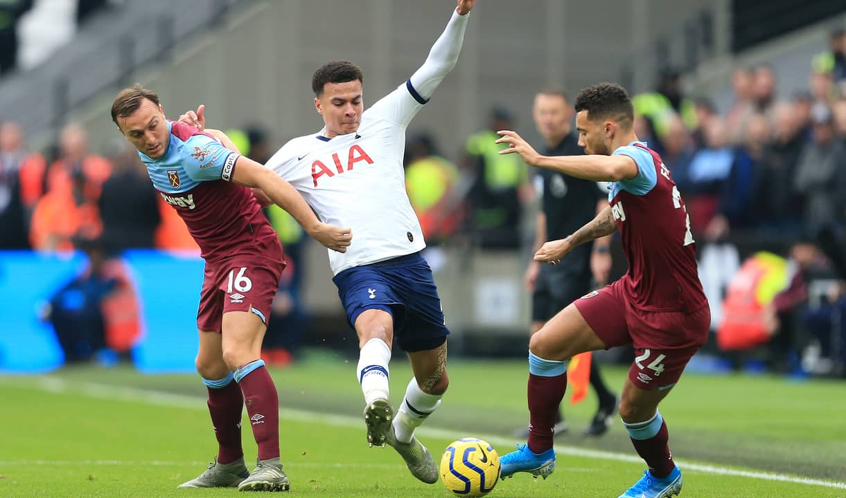 Mark Noble and Ryan Fredericks challenge Dele Alli