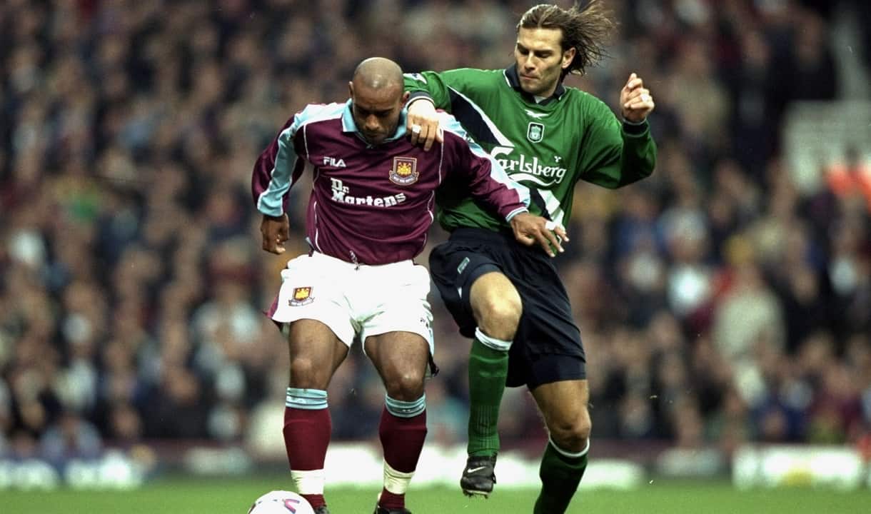 Trevor Sinclair takes the ball away from Patrik Berger