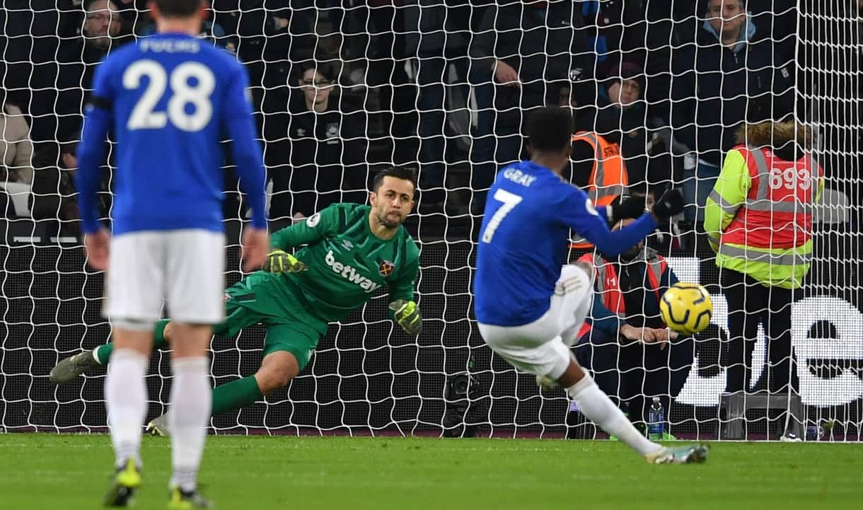 Lukasz Fabianski saves Demarai Gray's penalty