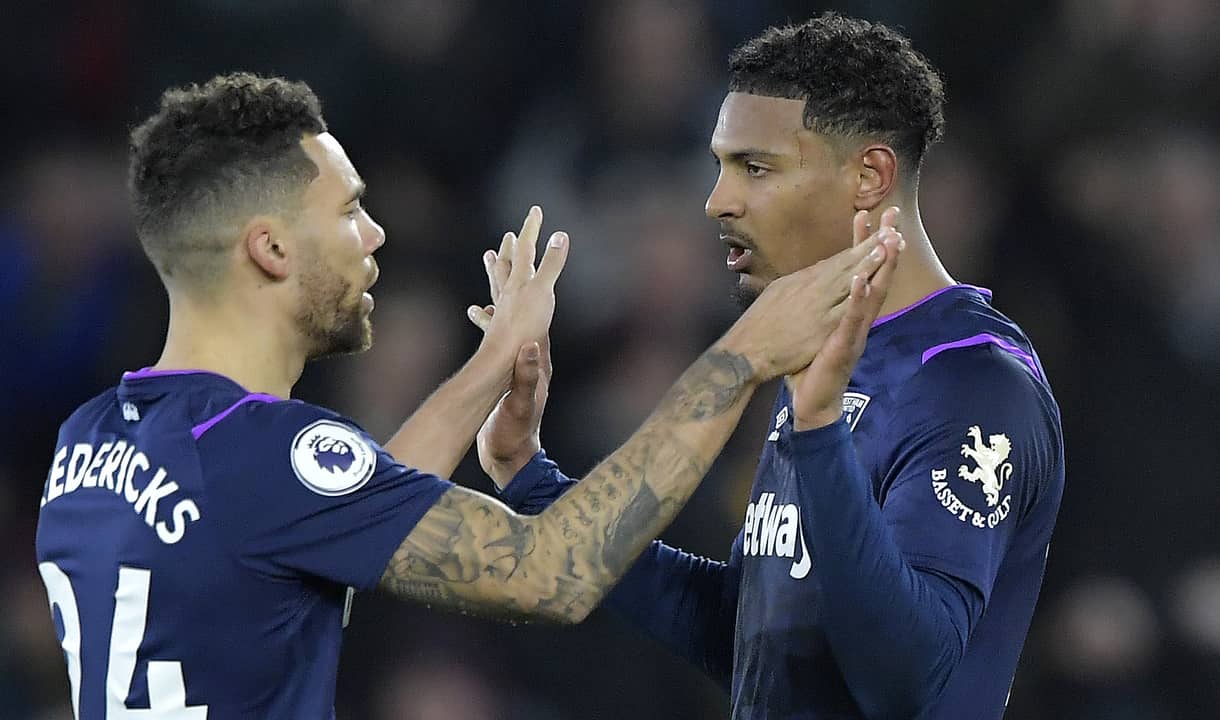 Sebastien Haller celebrates with Ryan Fredericks