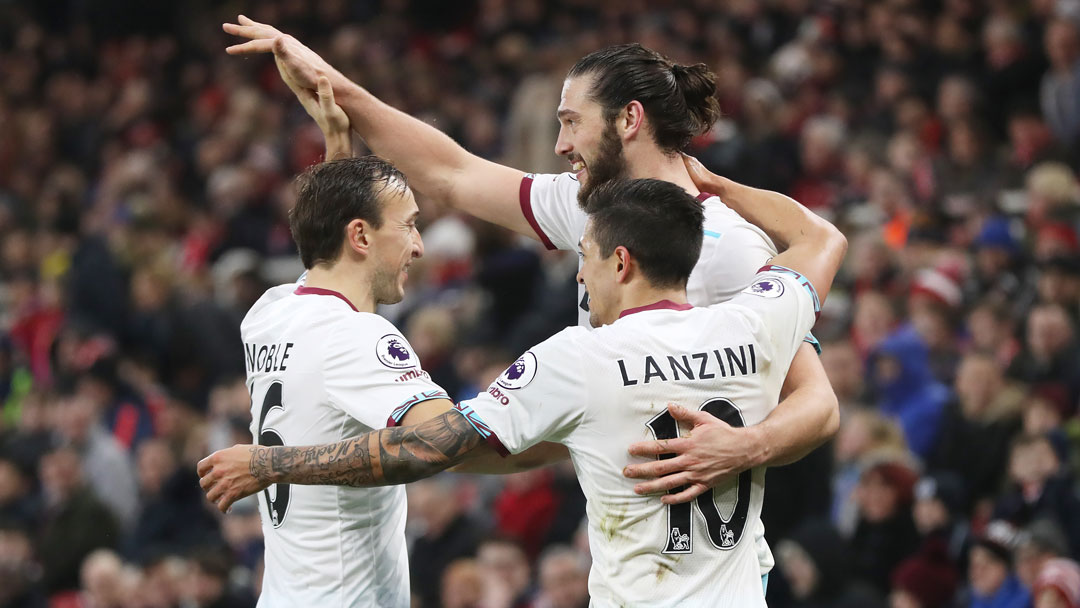 Andy Carroll celebrates with Mark Noble and Manuel Lanzini