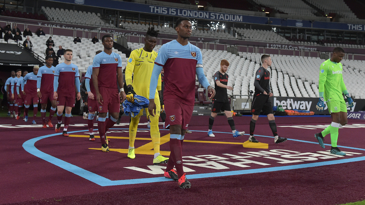 Olatunji Akinola leads his team out at London Stadium