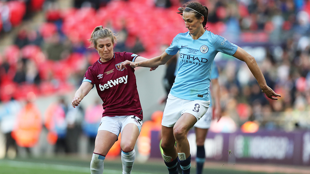 West Ham United's Kate Longhurst vies for the ball against Manchester City