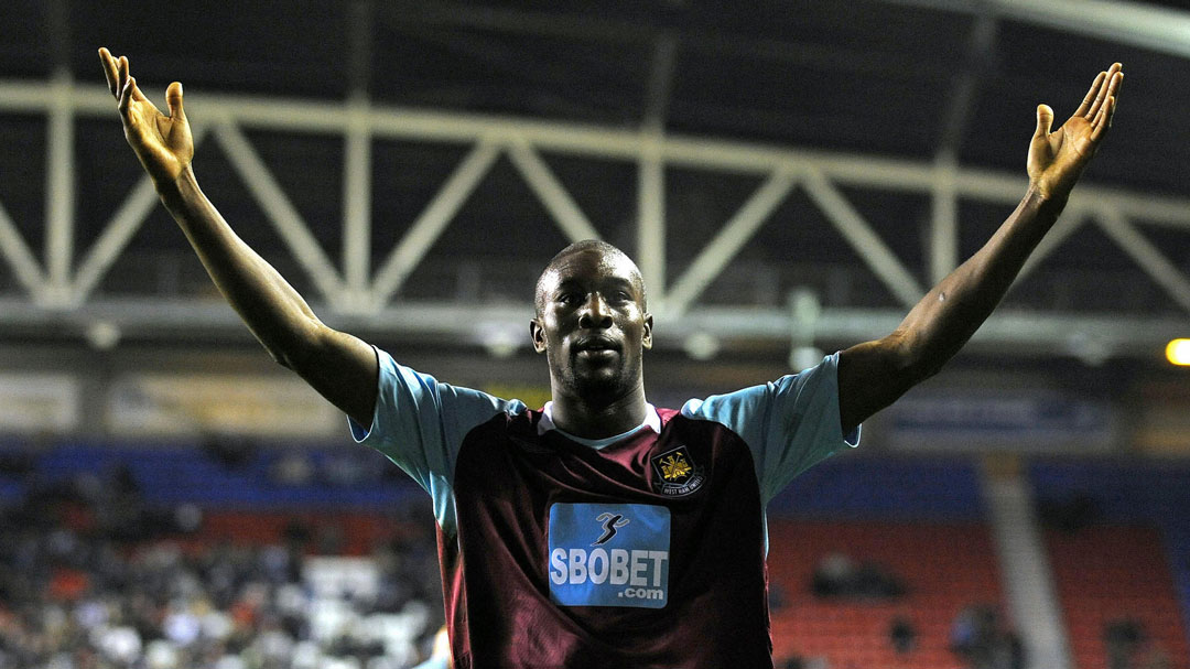 Carlton Cole celebrates at Wigan