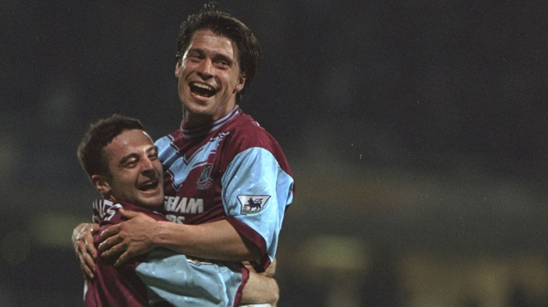 Tony Cottee celebrates scoring against Wimbledon in April 1995