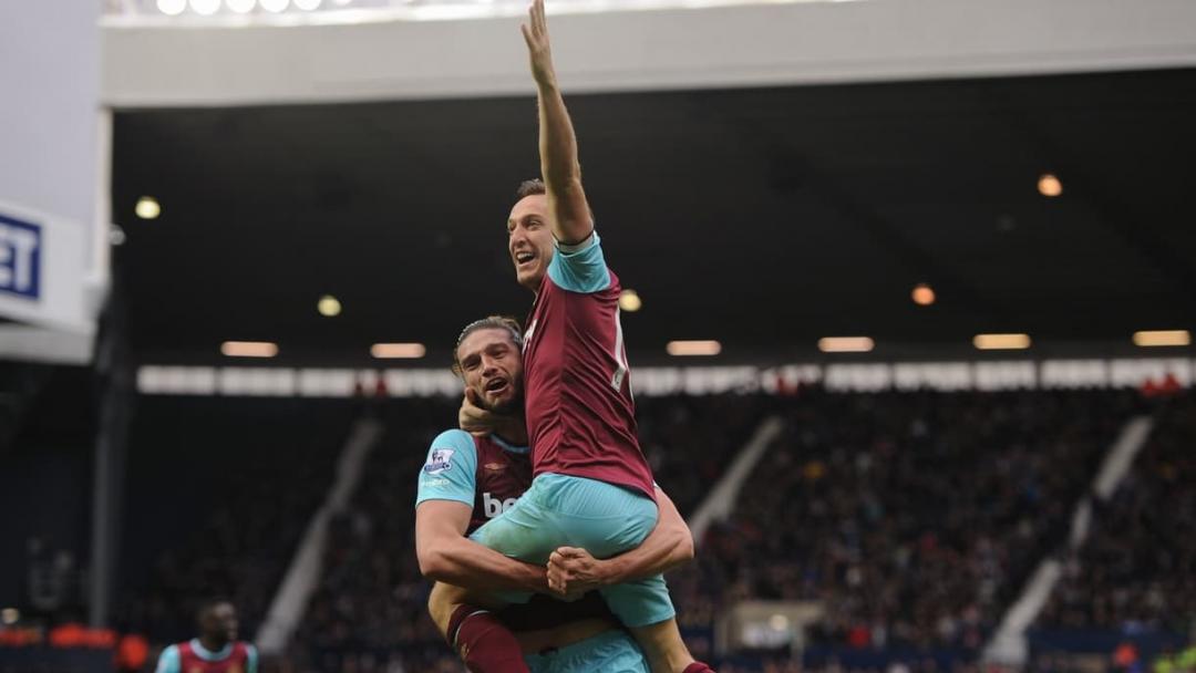 Mark Noble celebrates with Andy Carroll