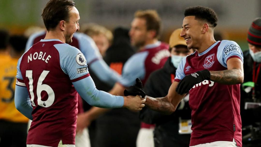 Mark Noble and Jesse Lingard celebrate at the final whistle at Wolves
