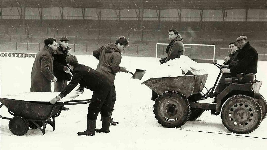 Groundstaff clear snow from the Boleyn Ground pitch in 1963