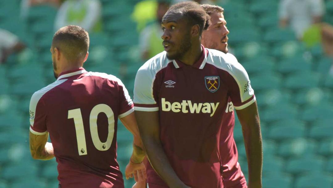 Michail Antonio celebrates his goal at Celtic