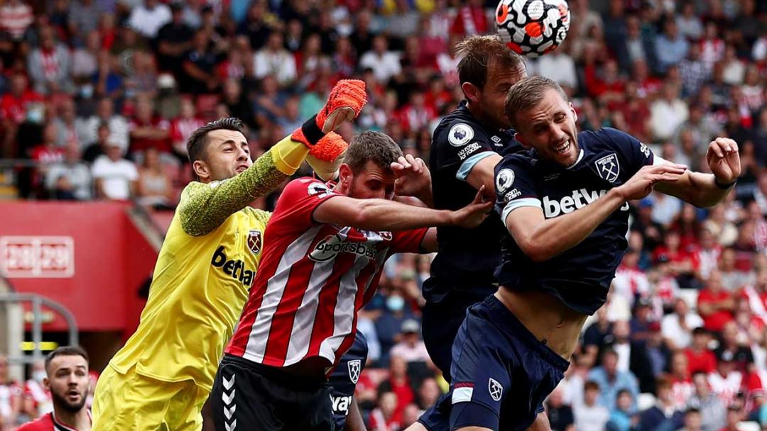 Tomas Soucek and Craig Dawson compete for a header at Southampton
