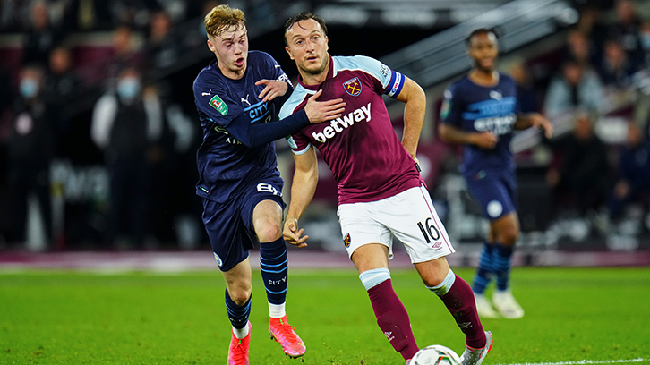 Manchester City's Cole Palmer up against Mark Noble