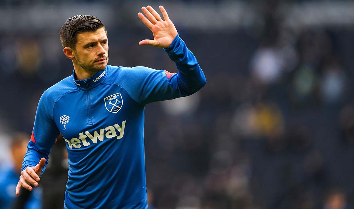 Aaron Cresswell waves to the fans