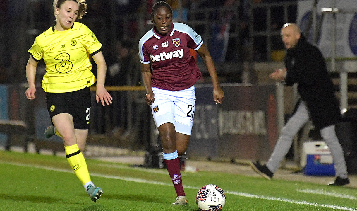 Hawa Cissoko running with the ball against Chelsea in the WSL