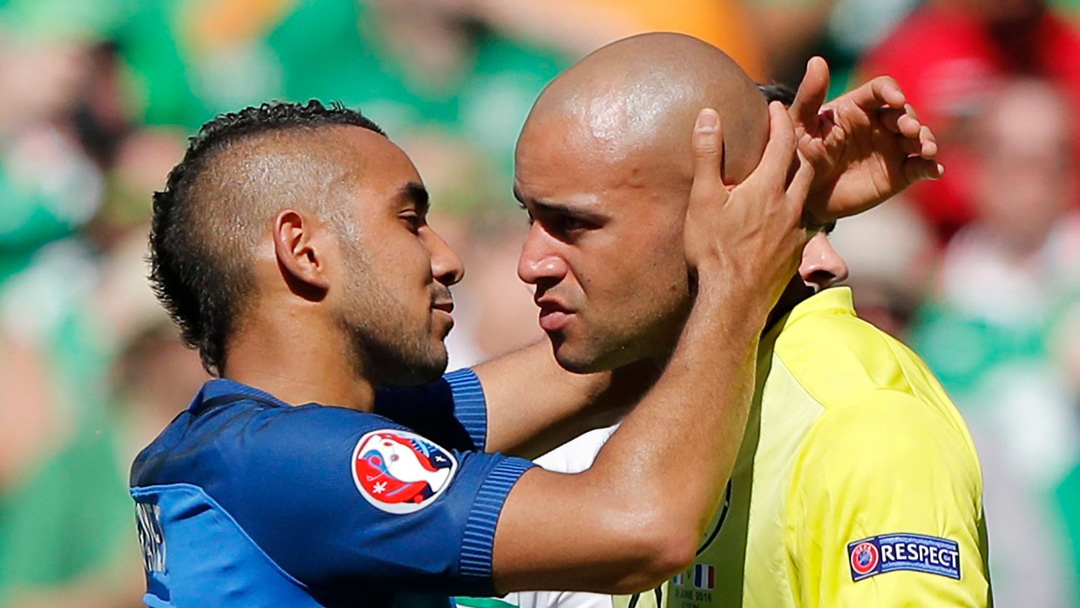 Dimitri Payet and Darren Randolph embrace