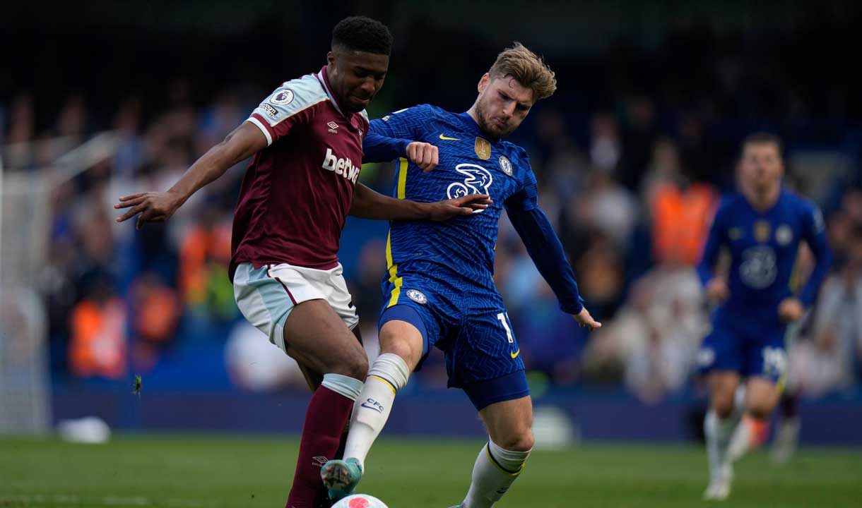 Ben Johnson and Timo Werner challenge for the ball