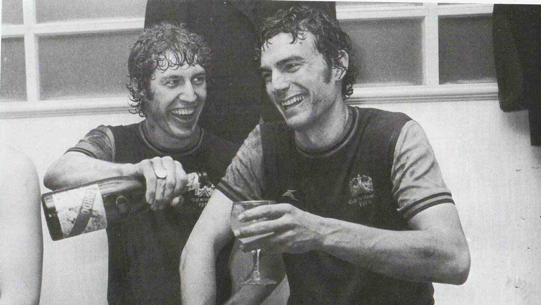 Pat Holland and Sir Trevor Brooking celebrate beating Eintracht Frankfurt in April 1976