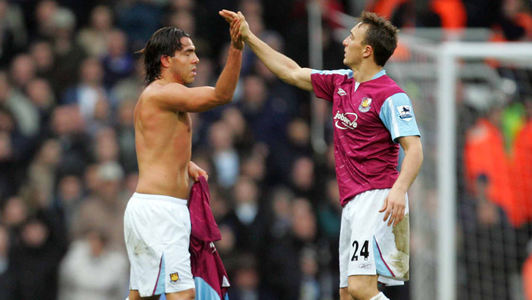 Carlos Tevez celebrates with Mark Noble