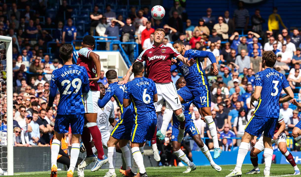 Andriy Yarmolenko competes for a header at Chelsea