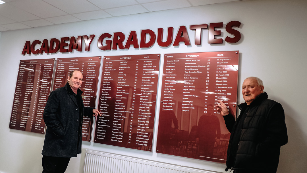 Jimmy Hampson and Jimmy Tindall view a list of Academy graduates at Chadwell Heath (2)