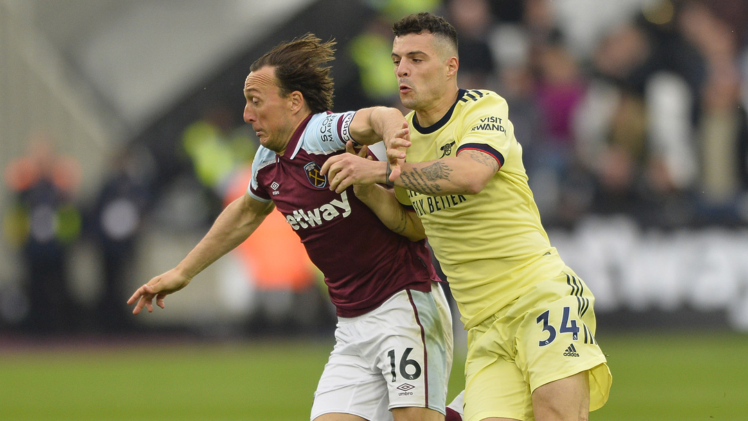 Mark Noble holds off Granit Xhaka