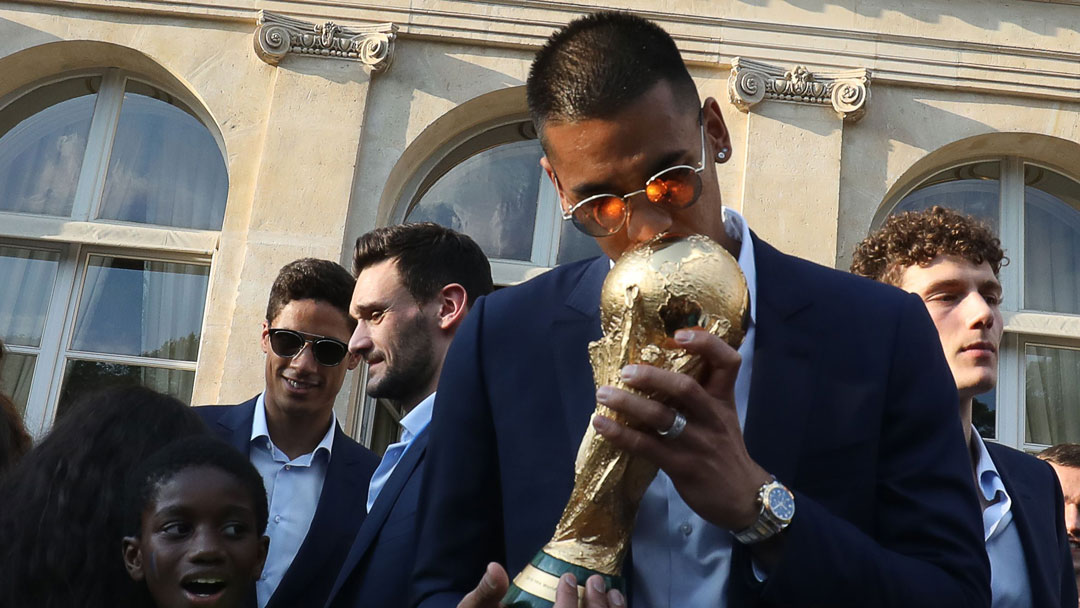 Alphonse Areola holds the FIFA World Cup trophy