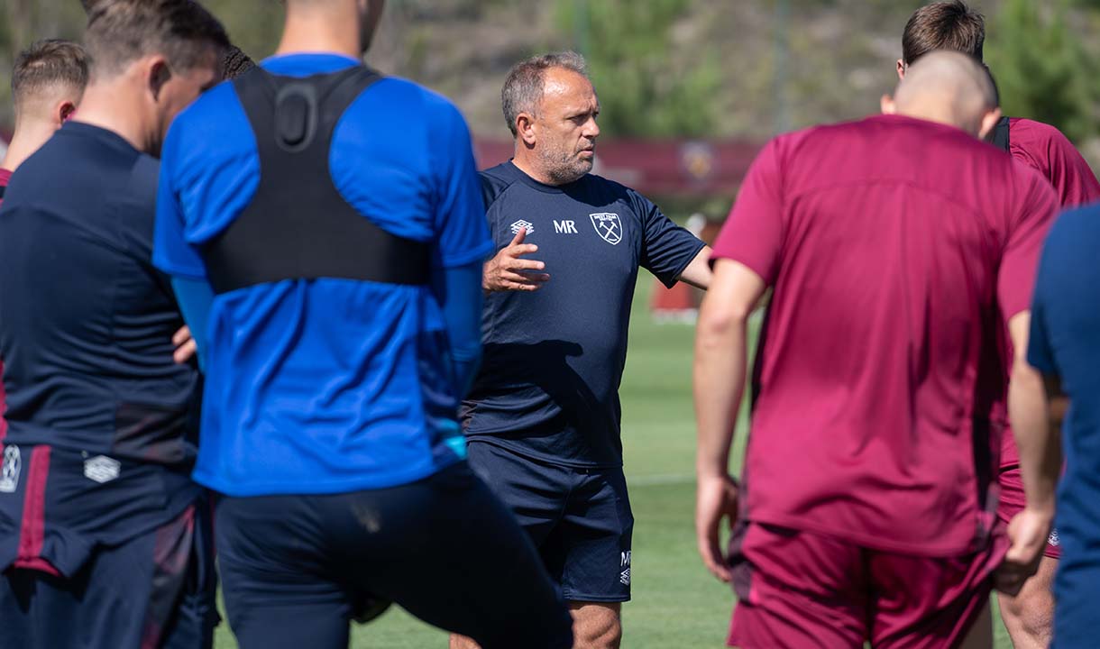 Mark Robson leads the U21s in a training session