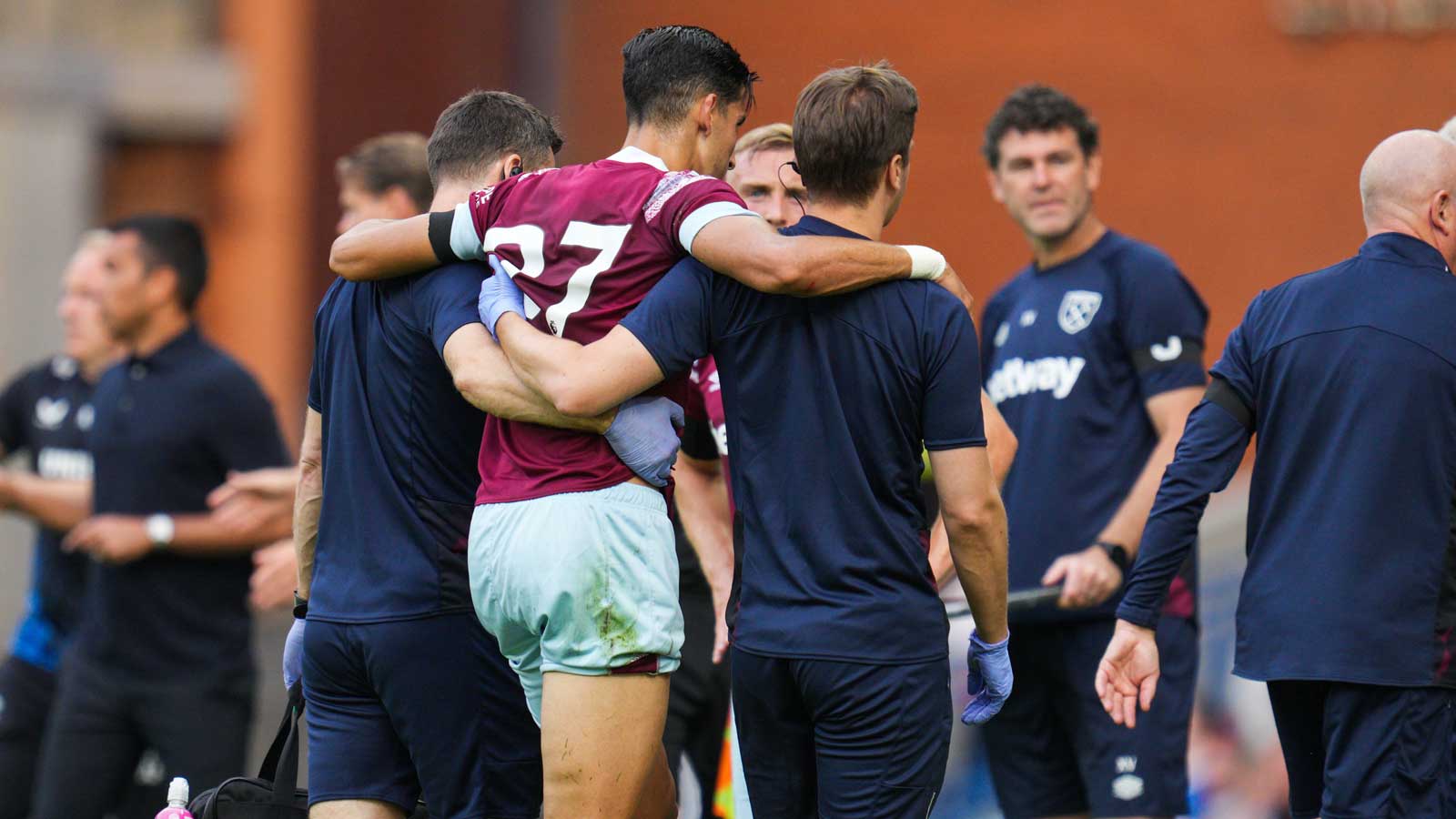 Nayef Aguerd is helped off the field