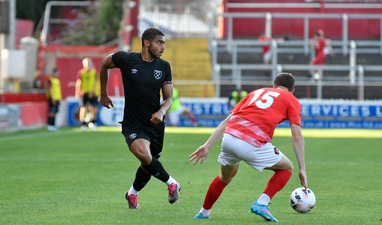 Will Greenidge plays a pass for West Ham United U21s in a pre-season match against Ebbsfleet United in July 2022