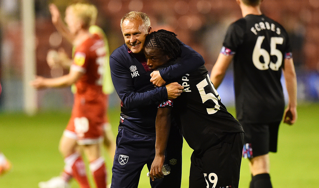 Mark Robson embraces Keenan Appiah-Forson at full-time in Walsall