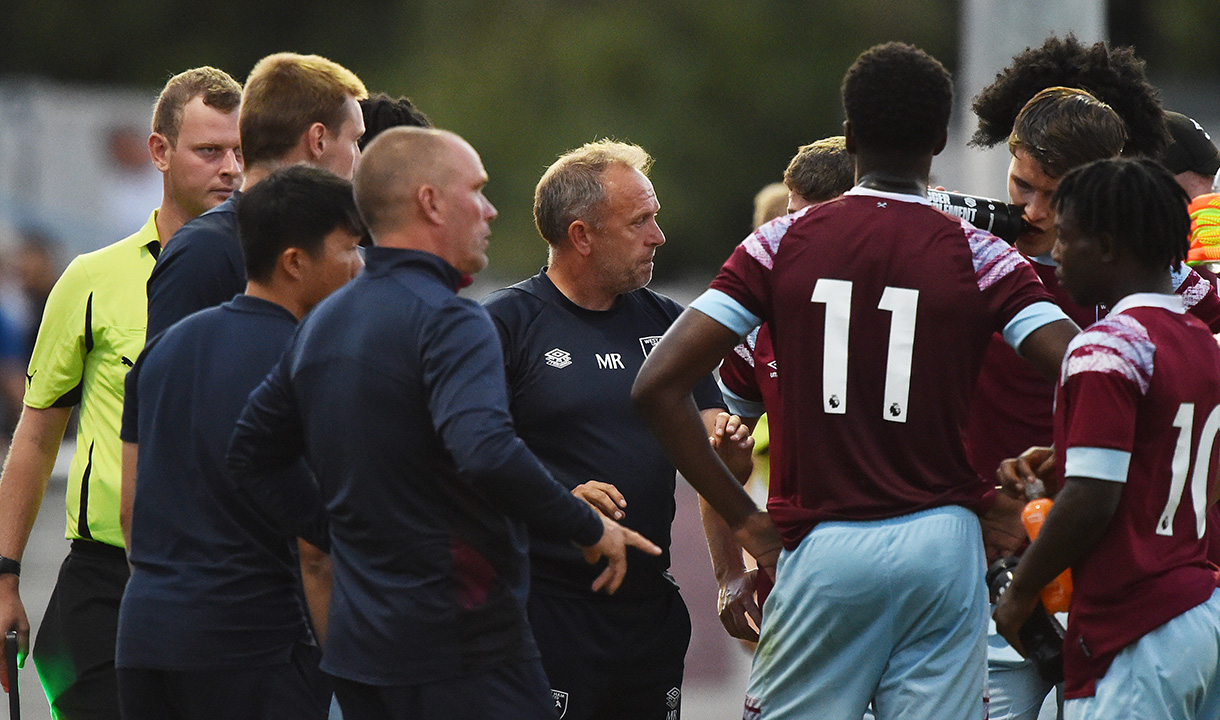 Mark Robson speaks to West Ham United U21s during their match with Arsenal