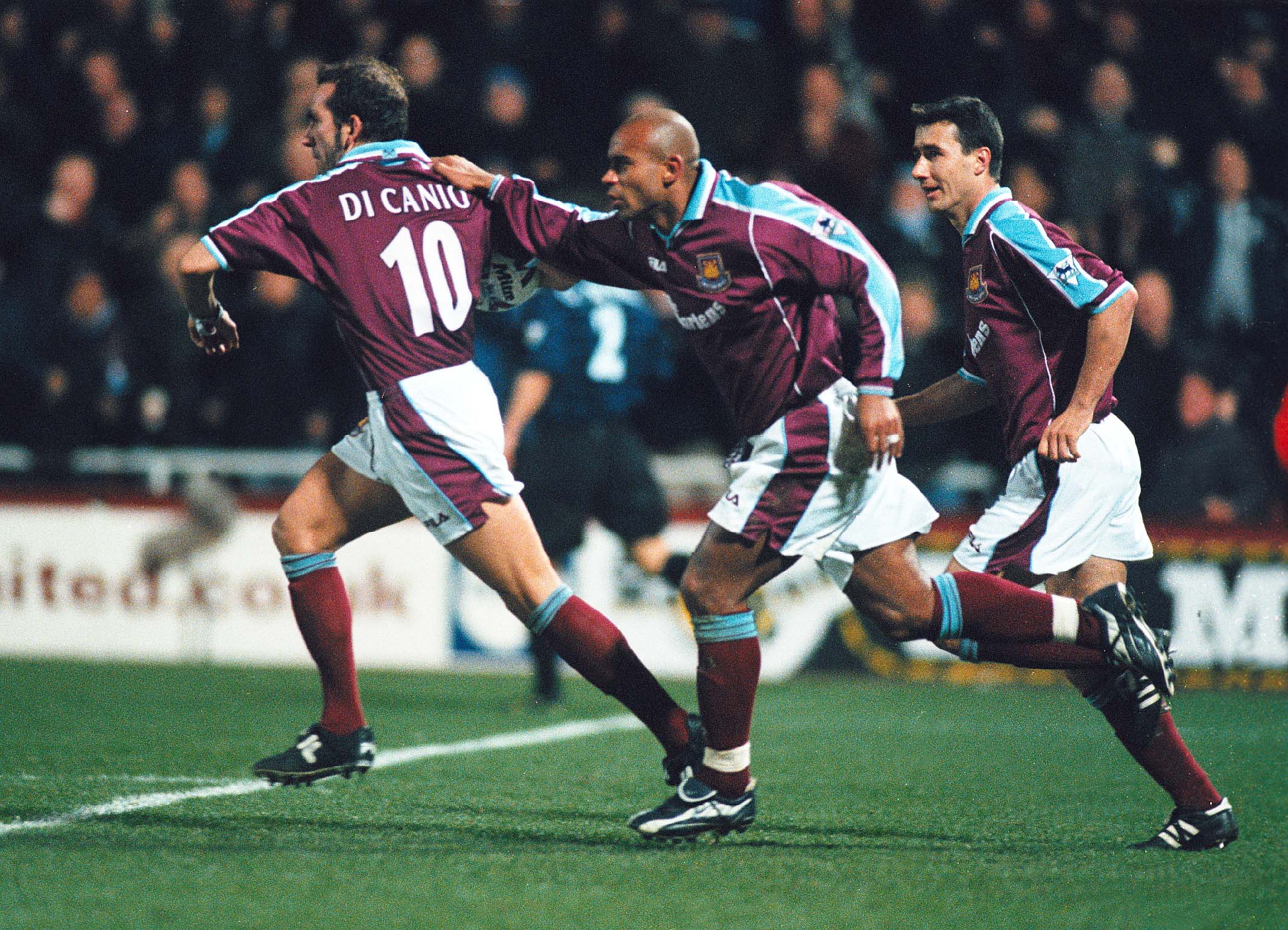 Trevor Sinclair celebrates with Paolo Di Canio