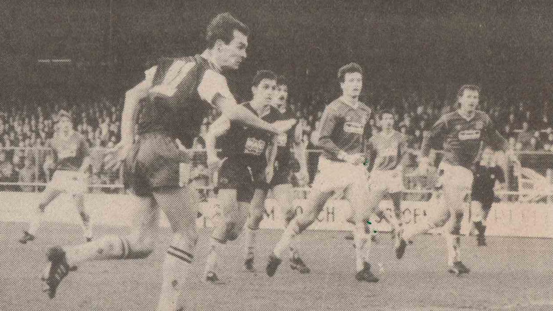 Jimmy Quinn scores a header