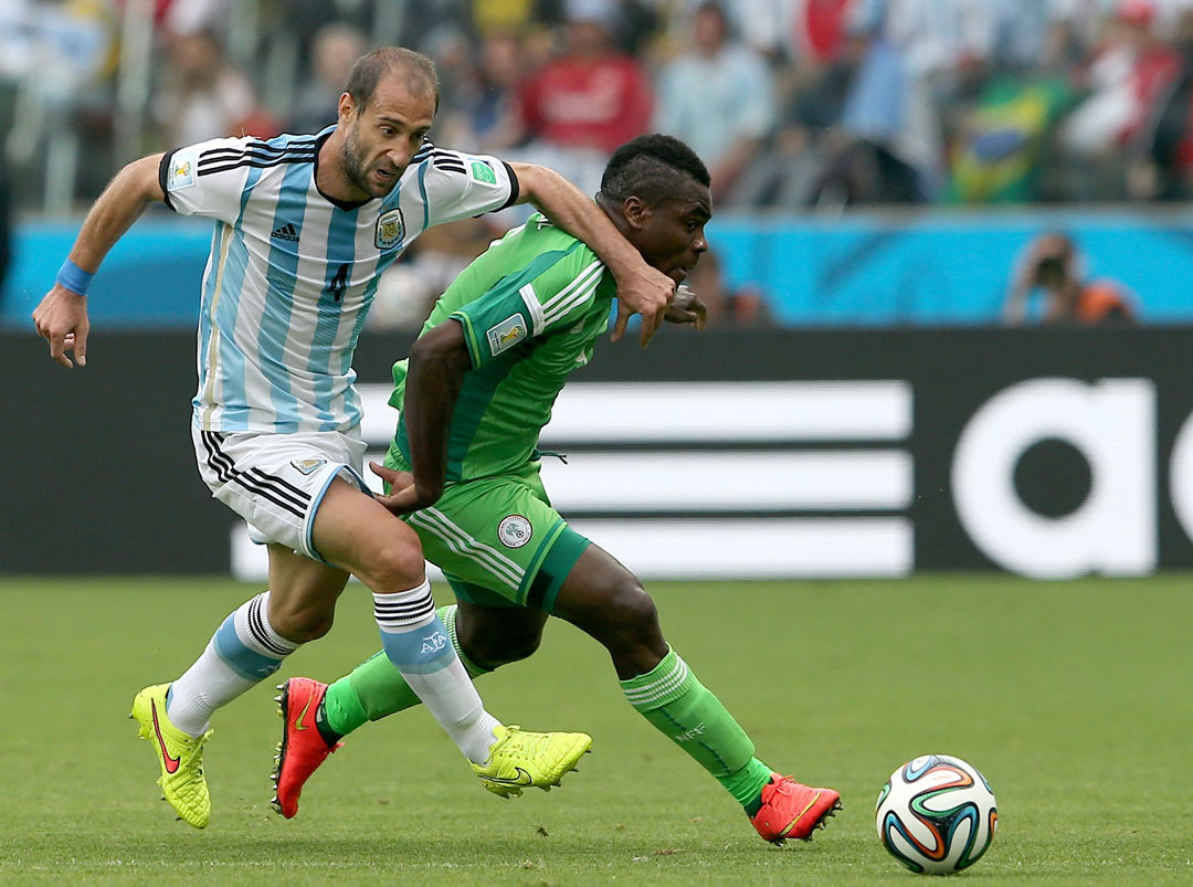 Pablo Zabaleta and Emmanuel Emenike in action at the 2014 World Cup