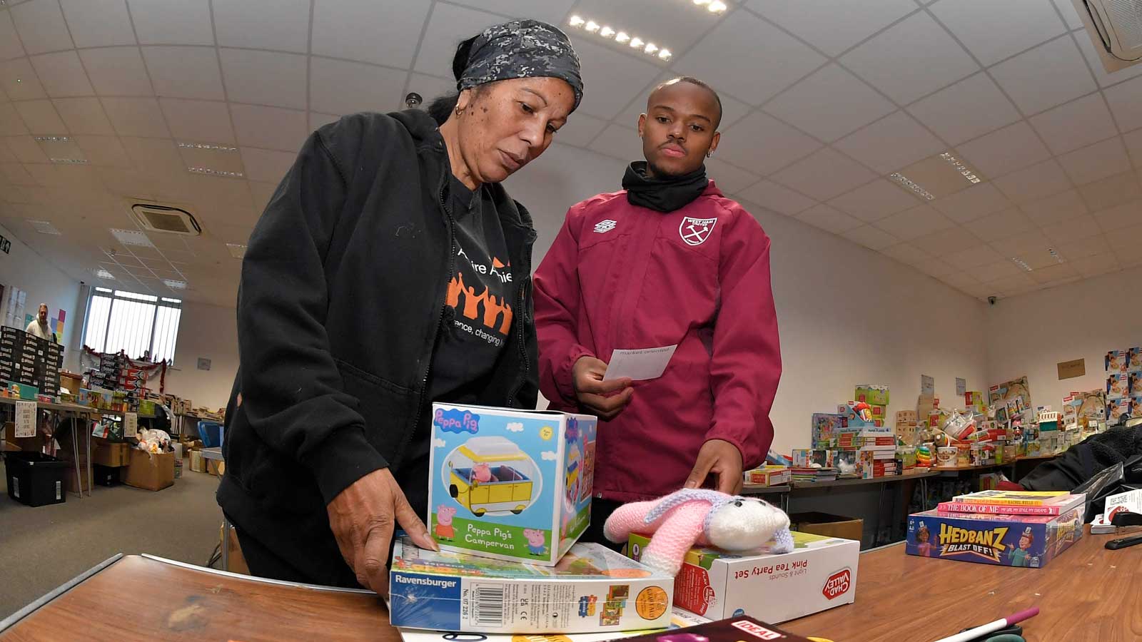 Remy Coddington helps select toys for the appeal