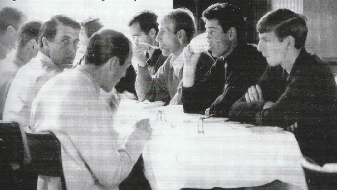 Sir Geoff Hurst and Martin Peters eat a meal with their England teammates