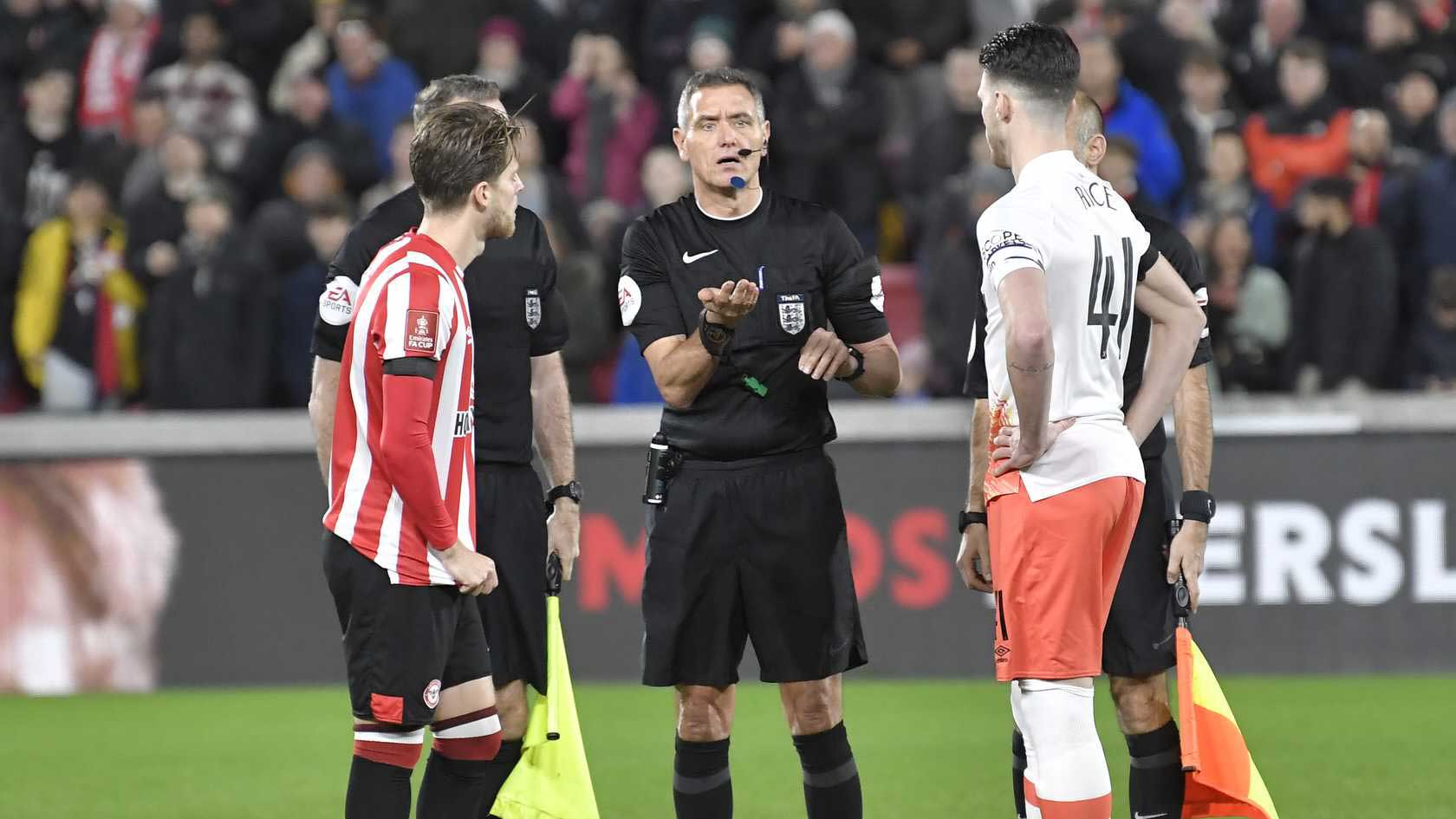 The two captains with the referee at West Ham's FA Cup tie against Brentford