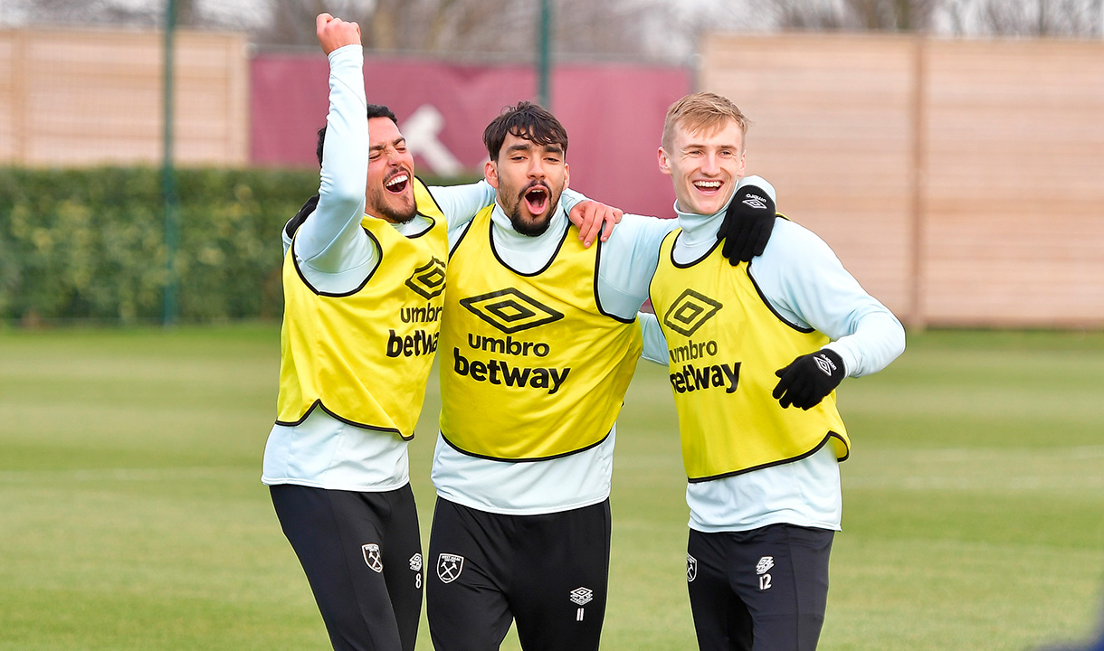 Fornals, Paqueta and Downes celebrate in training