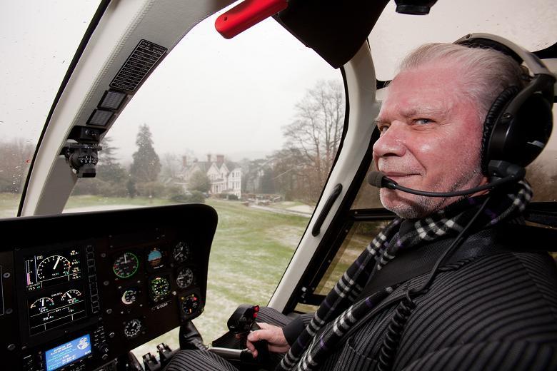 David Gold in his helicopter