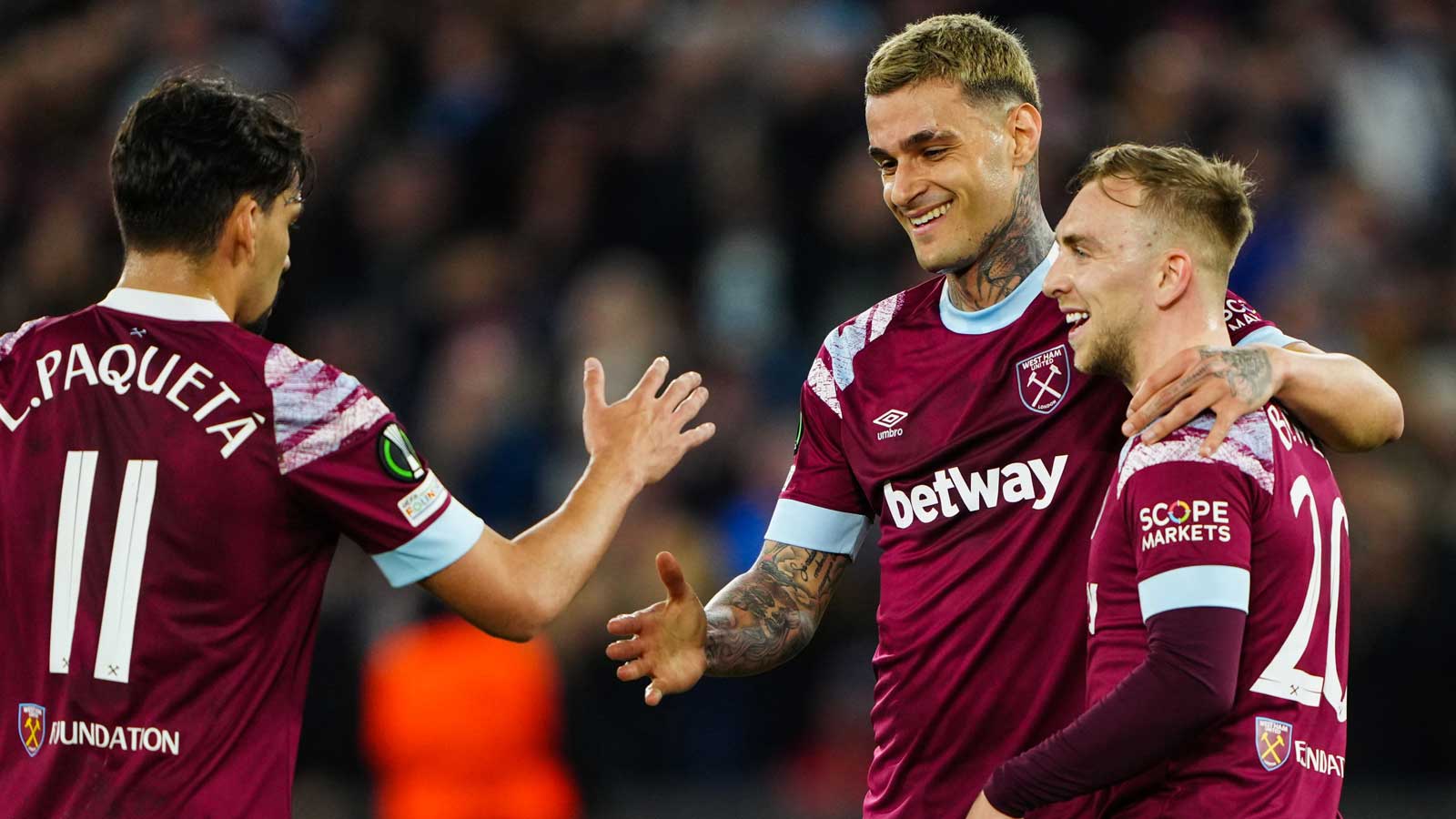 Gianluca Scamacca celebrates with Lucas Paquetá and Jarrod Bowen