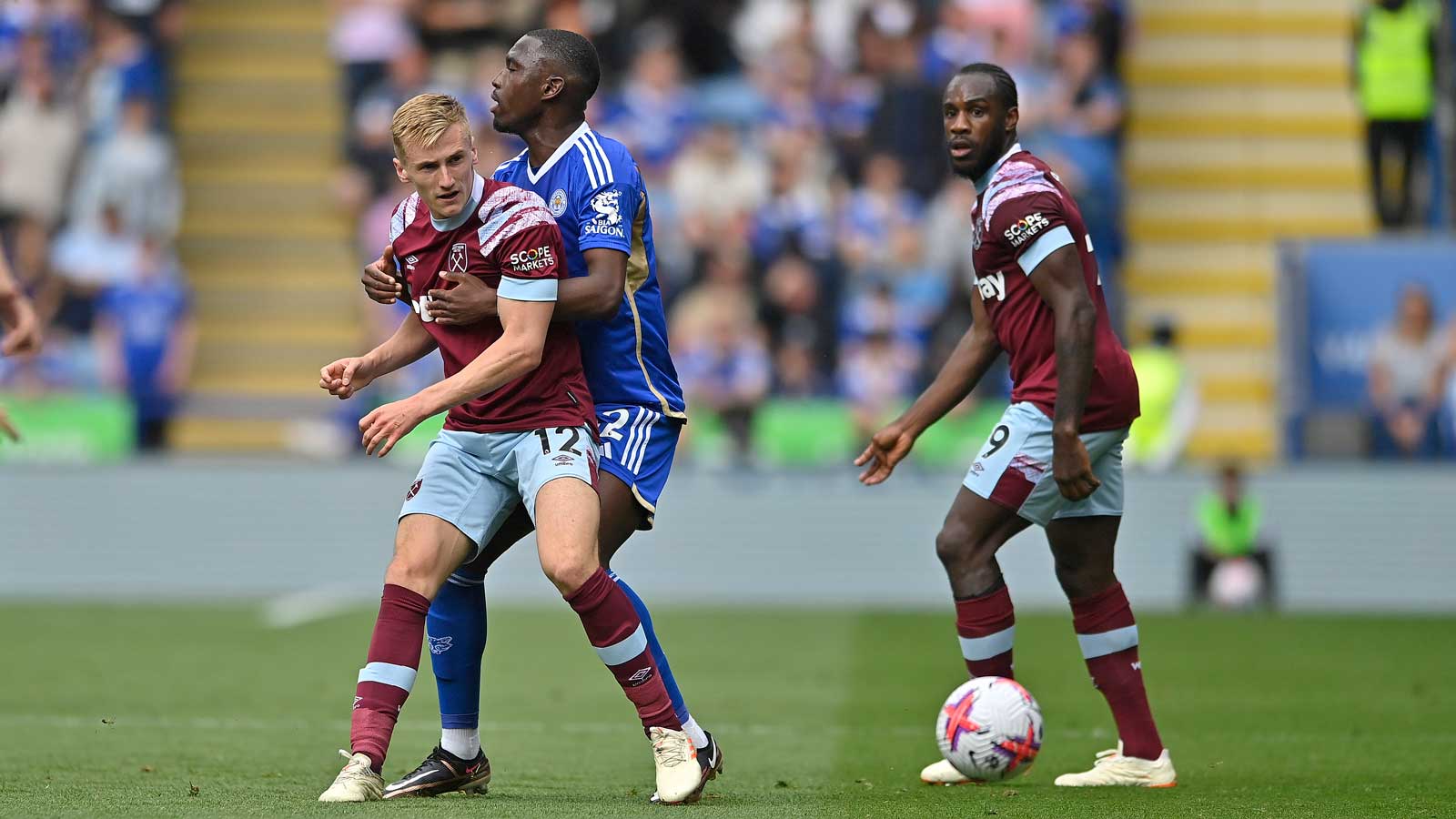 Flynn Downes battles with Leicester City midfielder Boubakary Soumaré