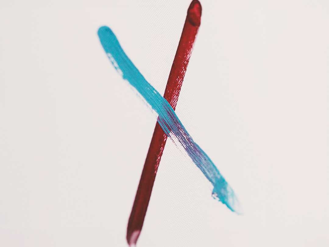 A Claret and Blue cross on a white background