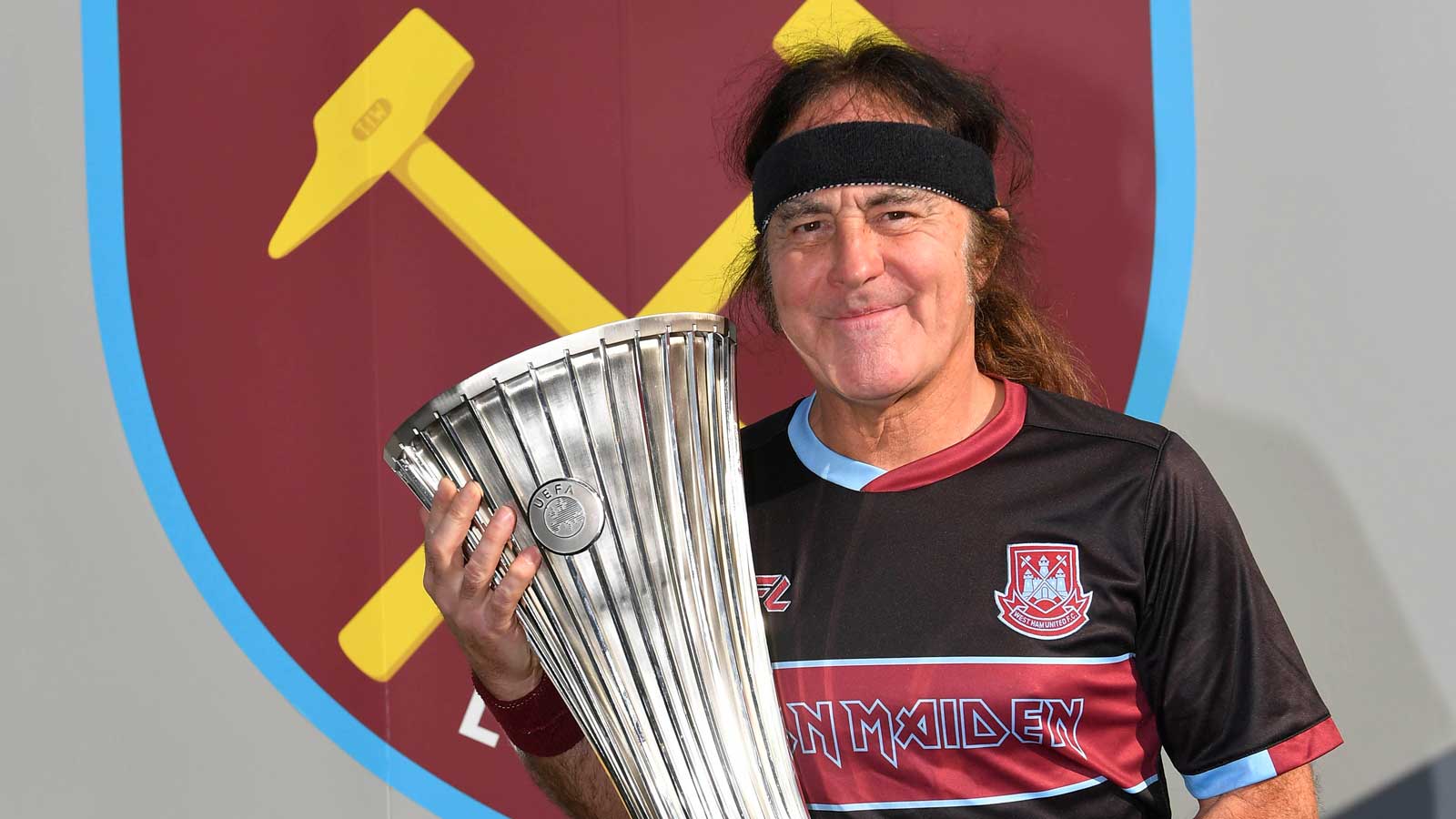 Iron Maiden's Steve Harris with the UEFA Europa Conference League Trophy