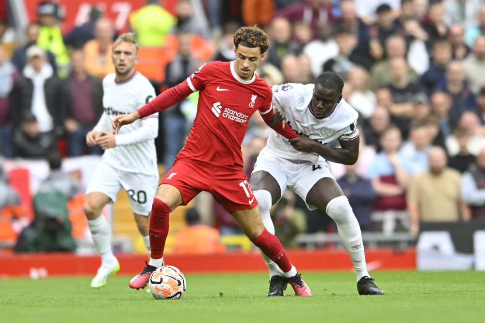 Kurt Zouma challenges Liverpool's Curtis Jones