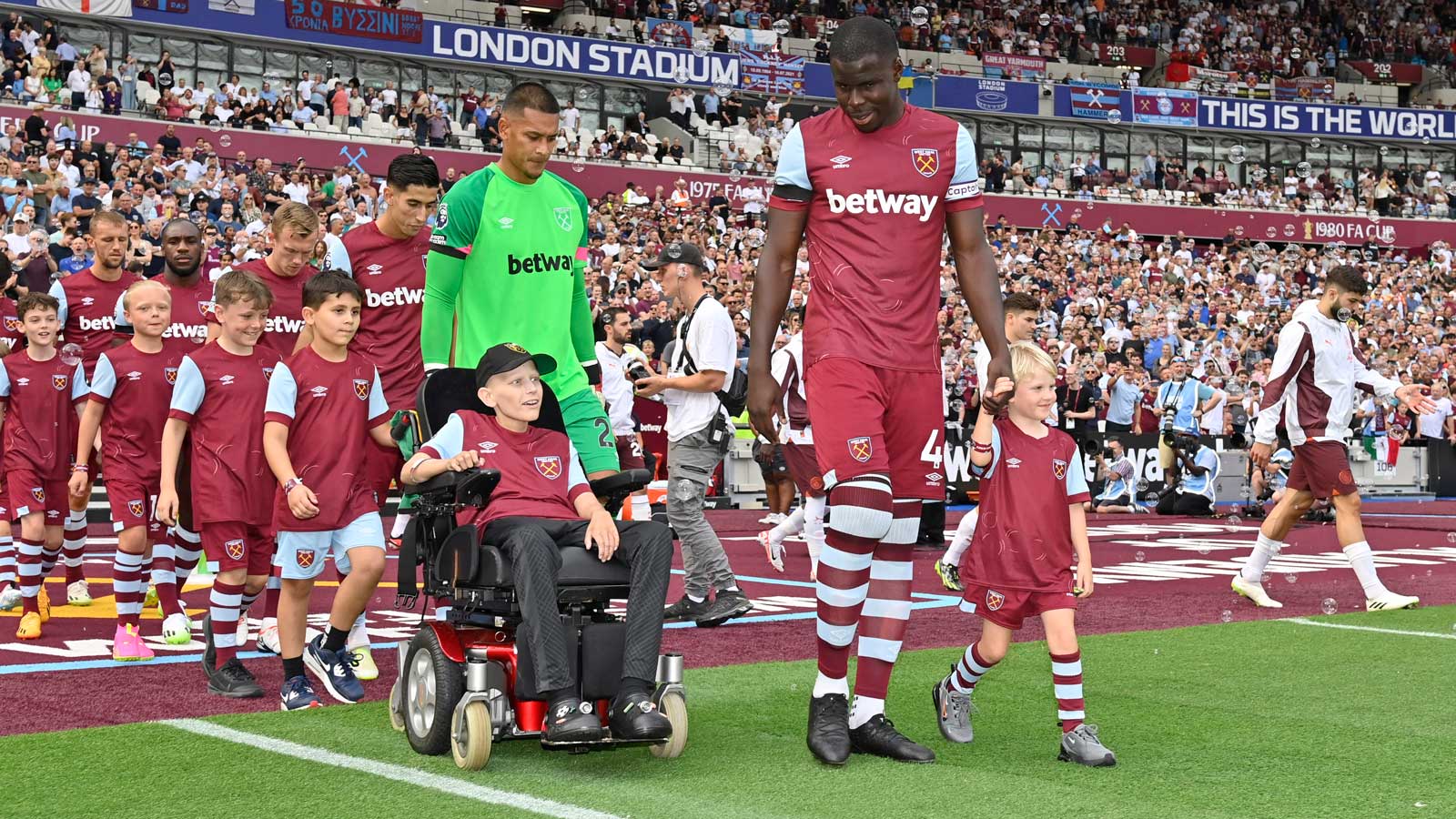 Charlie leads the Hammers out as mascot against Manchester City