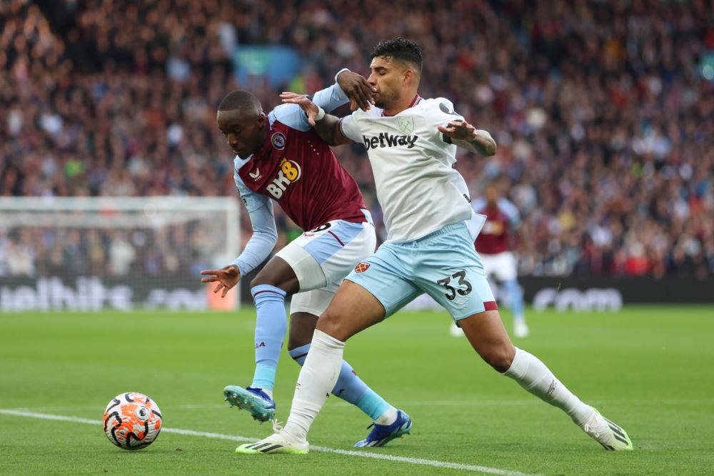 Emerson challenges for the ball at Aston Villa