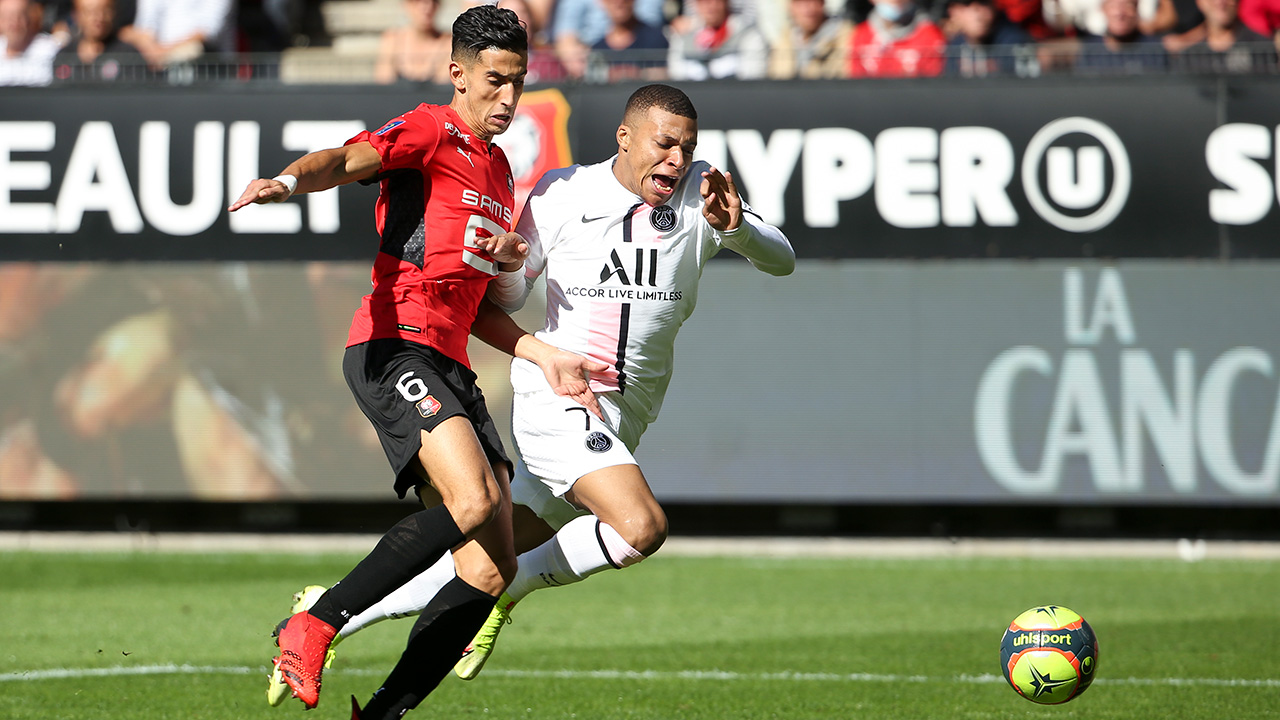 Nayef Aguerd, for Rennes, takes on Kylian Mbappe of PSG
