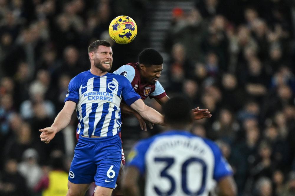 Ben Johnson challenges for a header against Brighton