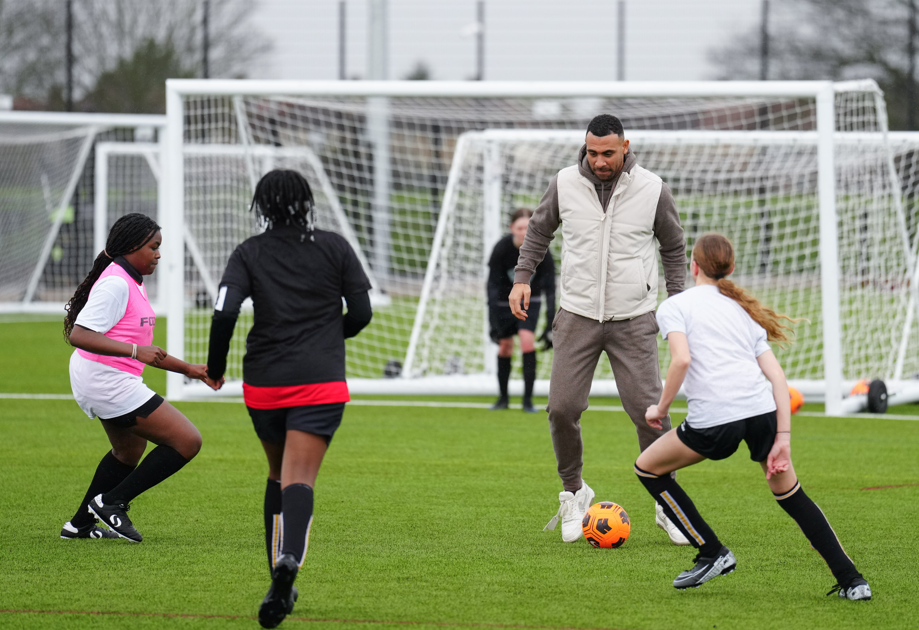 Anton Ferdinand with kids at the Bobby Moore Sports Hub